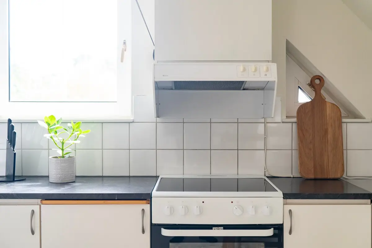 Kitchen with induction hob and oven